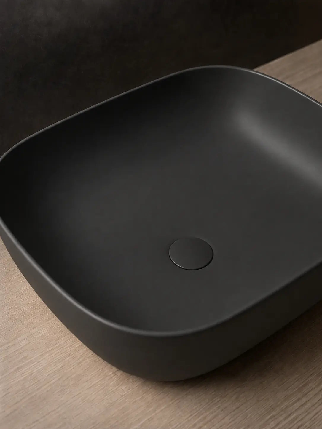 Matching solid matte black ceramic drain cover on BBbidet 2578 basin