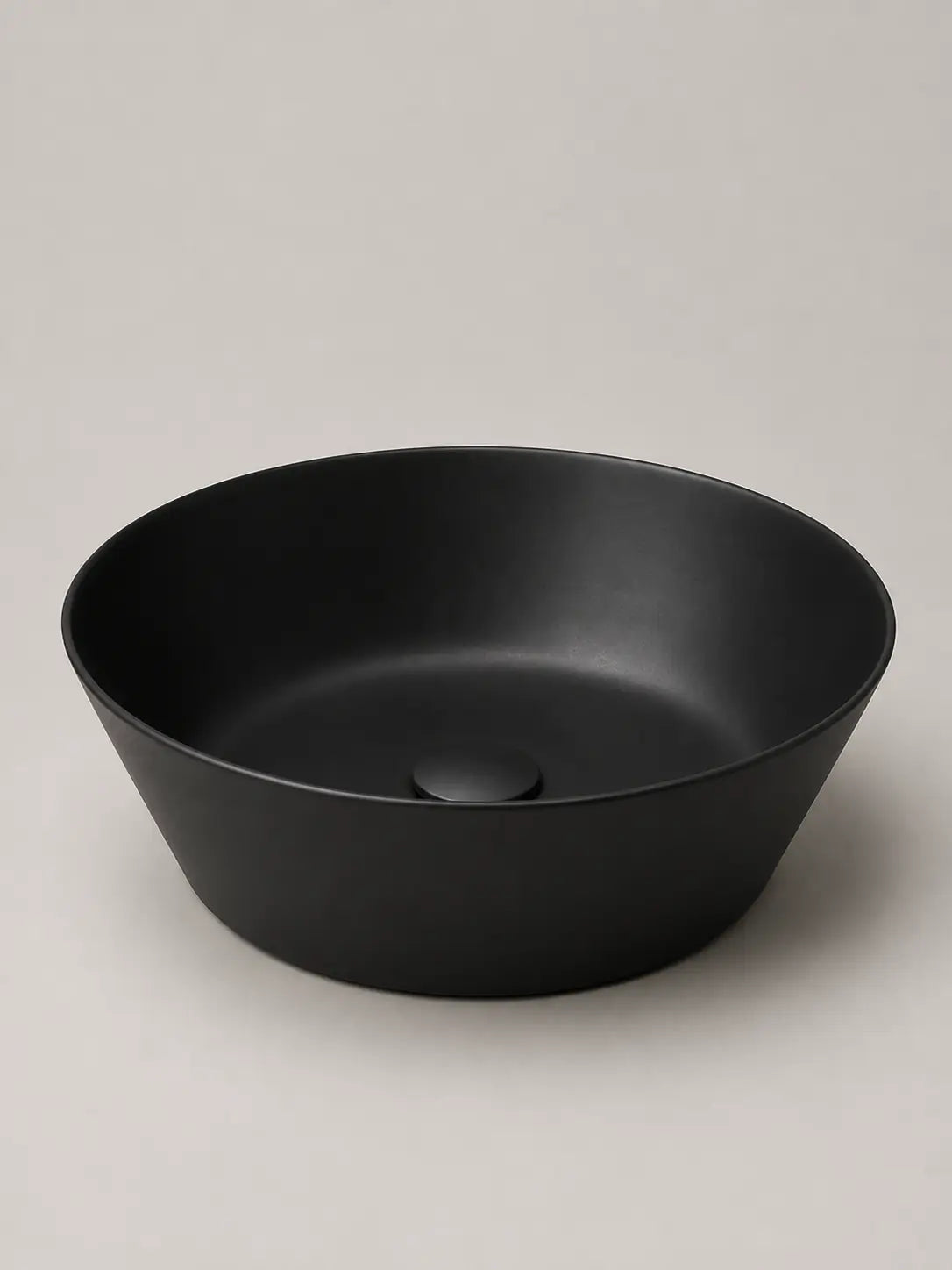 BBbidet 2603 matte black round ceramic countertop basin, studio product view