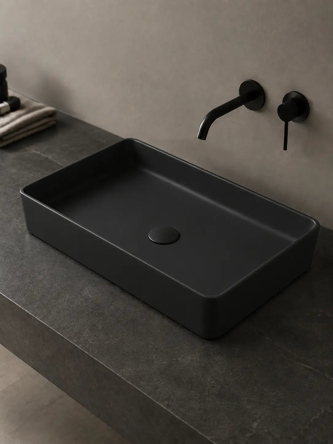 Angled view of BBbidet 2605 matte black rectangular ceramic countertop basin