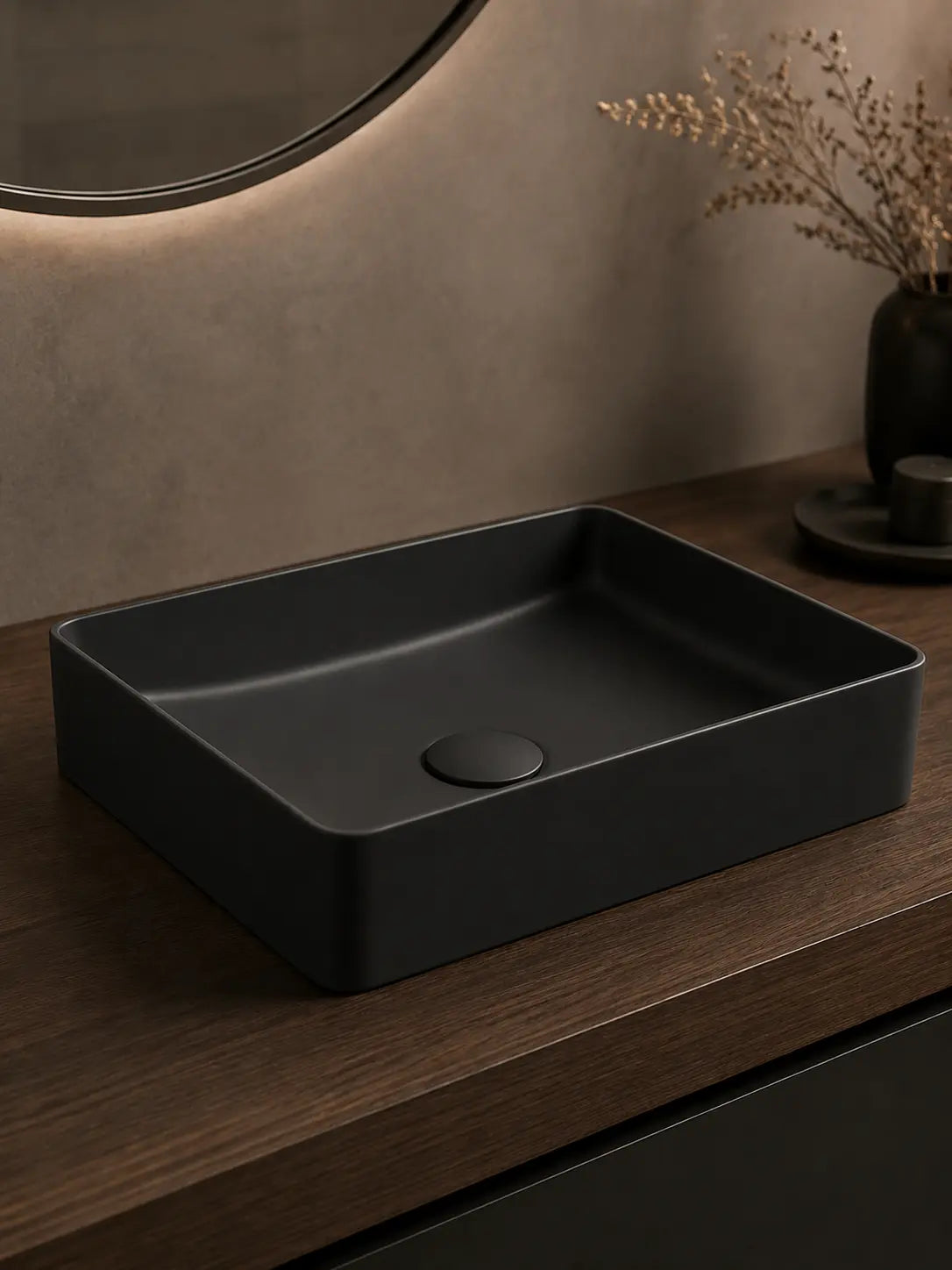 Angled view of BBbidet 2620 matte black rounded rectangle countertop basin