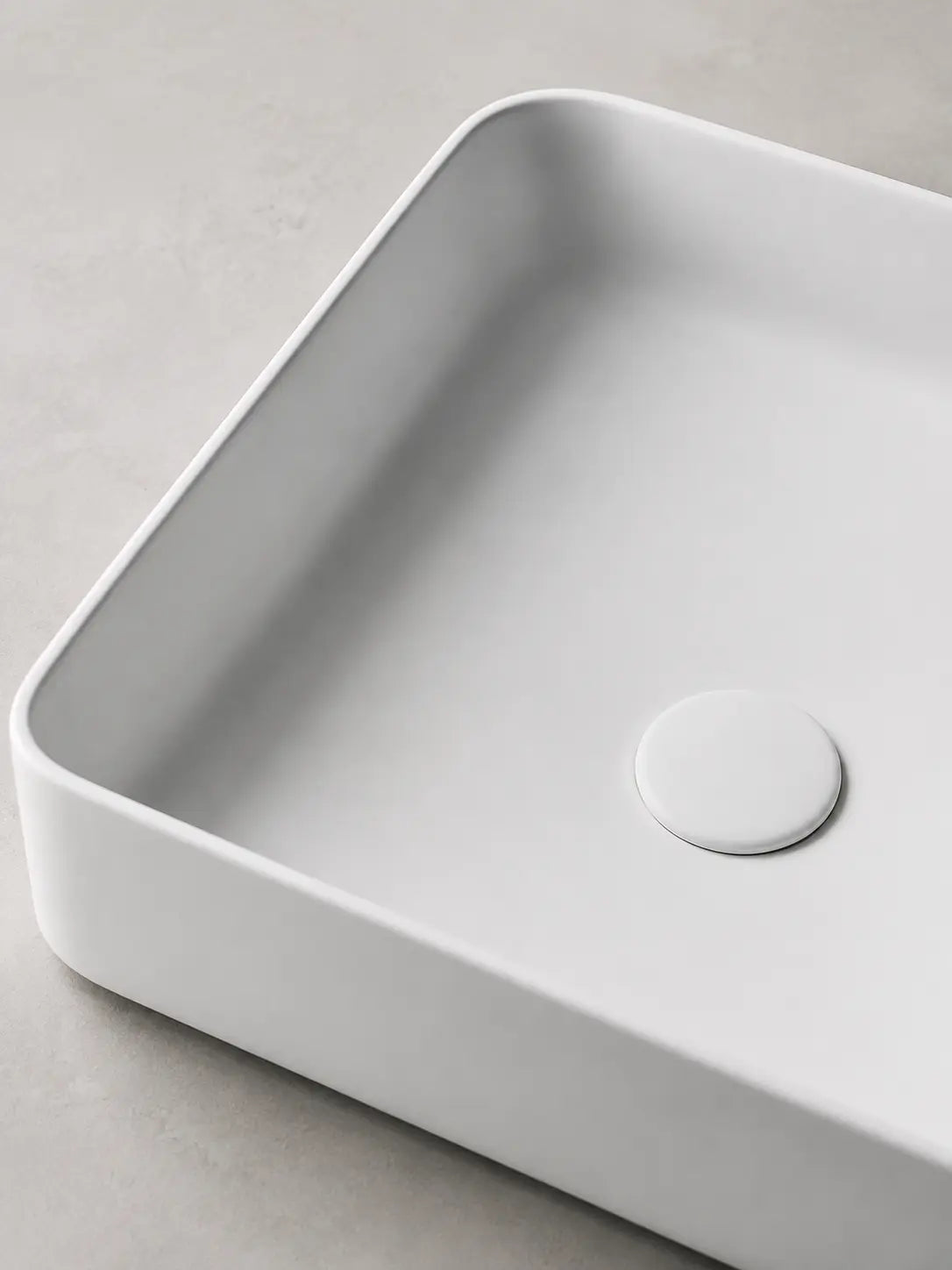 Close-up of the slim rim and matte white ceramic finish on BBbidet 2620 basin