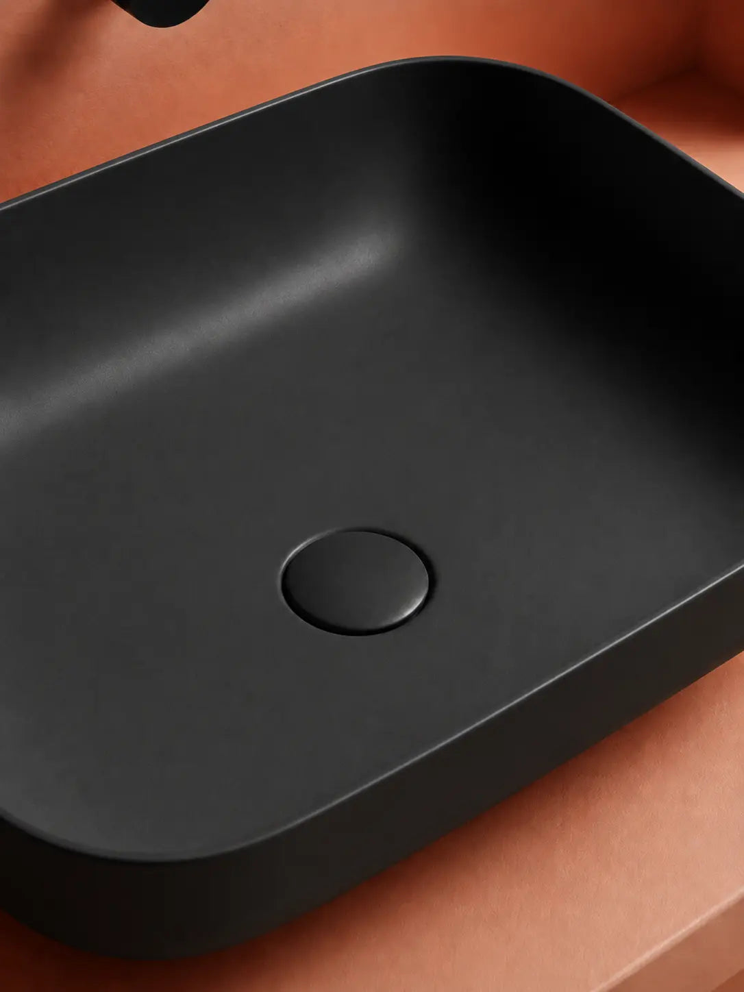 BBBIDET 2679 Matte Black rounded rectangle countertop basin - ceramic drain cover detail