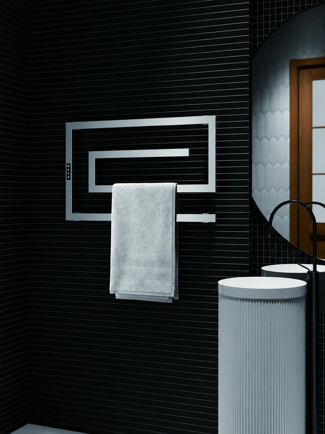AL101 rectangular wall mounted electric towel warmer holding a folded towel