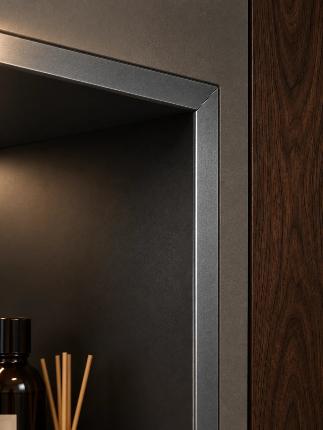 AL502 gunmetal frame meeting the wall in a recessed installation