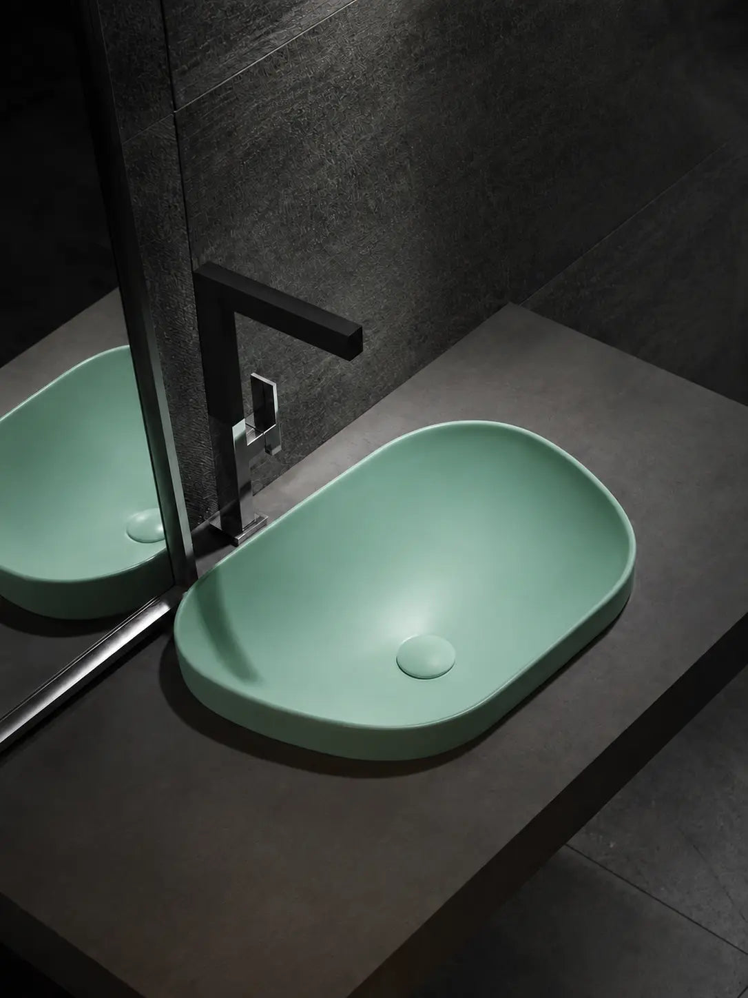 BBbidet V4 matte green semi-recessed basin in a dark modern bathroom