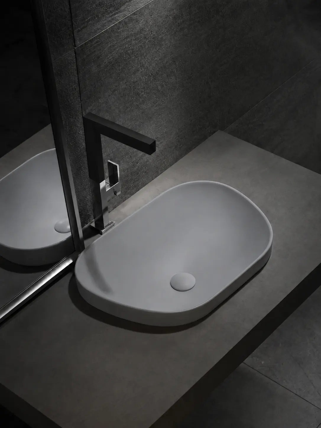 BBbidet V4 matte gray semi-recessed basin in a dark modern bathroom