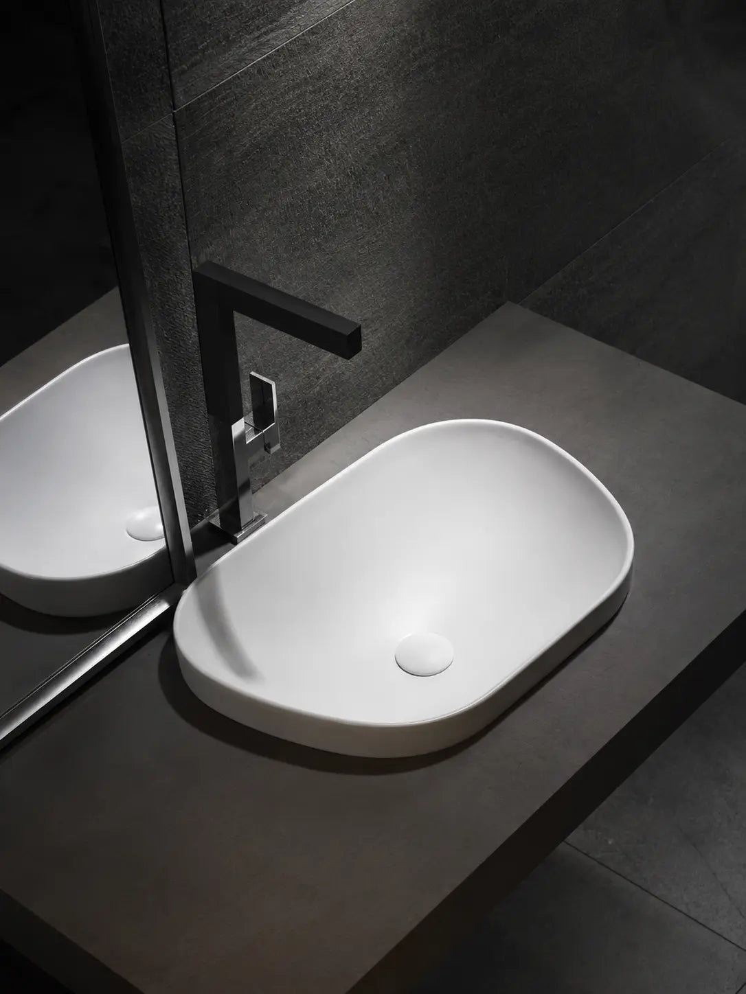 BBbidet V4 matte white semi-recessed basin in a dark modern bathroom