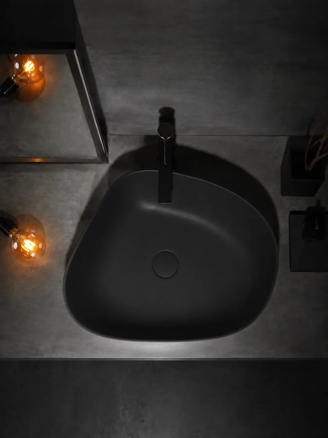 BBbidet V5 matte black asymmetric countertop basin in a dark bathroom vanity setting