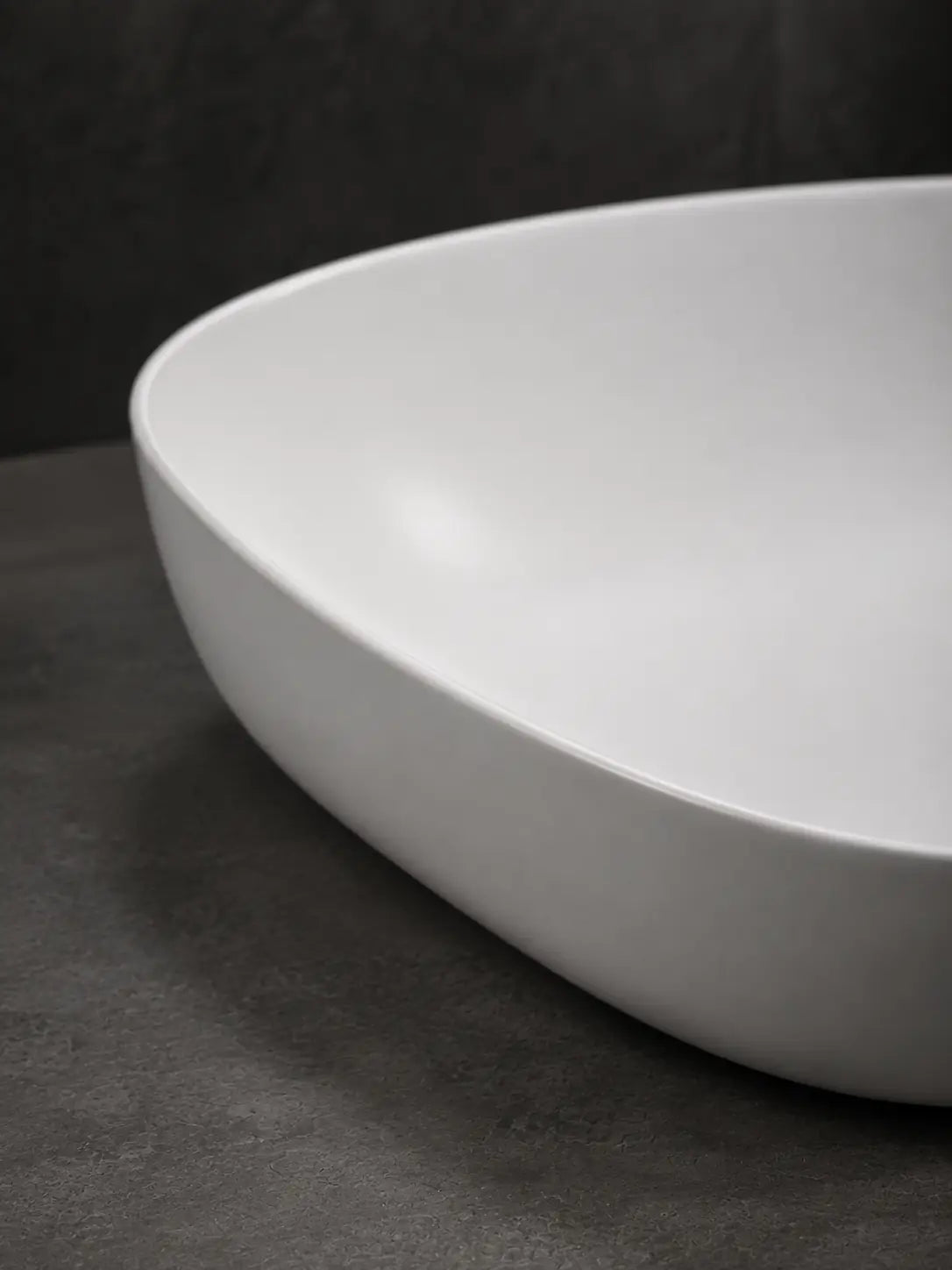 Close-up of the thin rim on the BBbidet V5 matte white ceramic basin