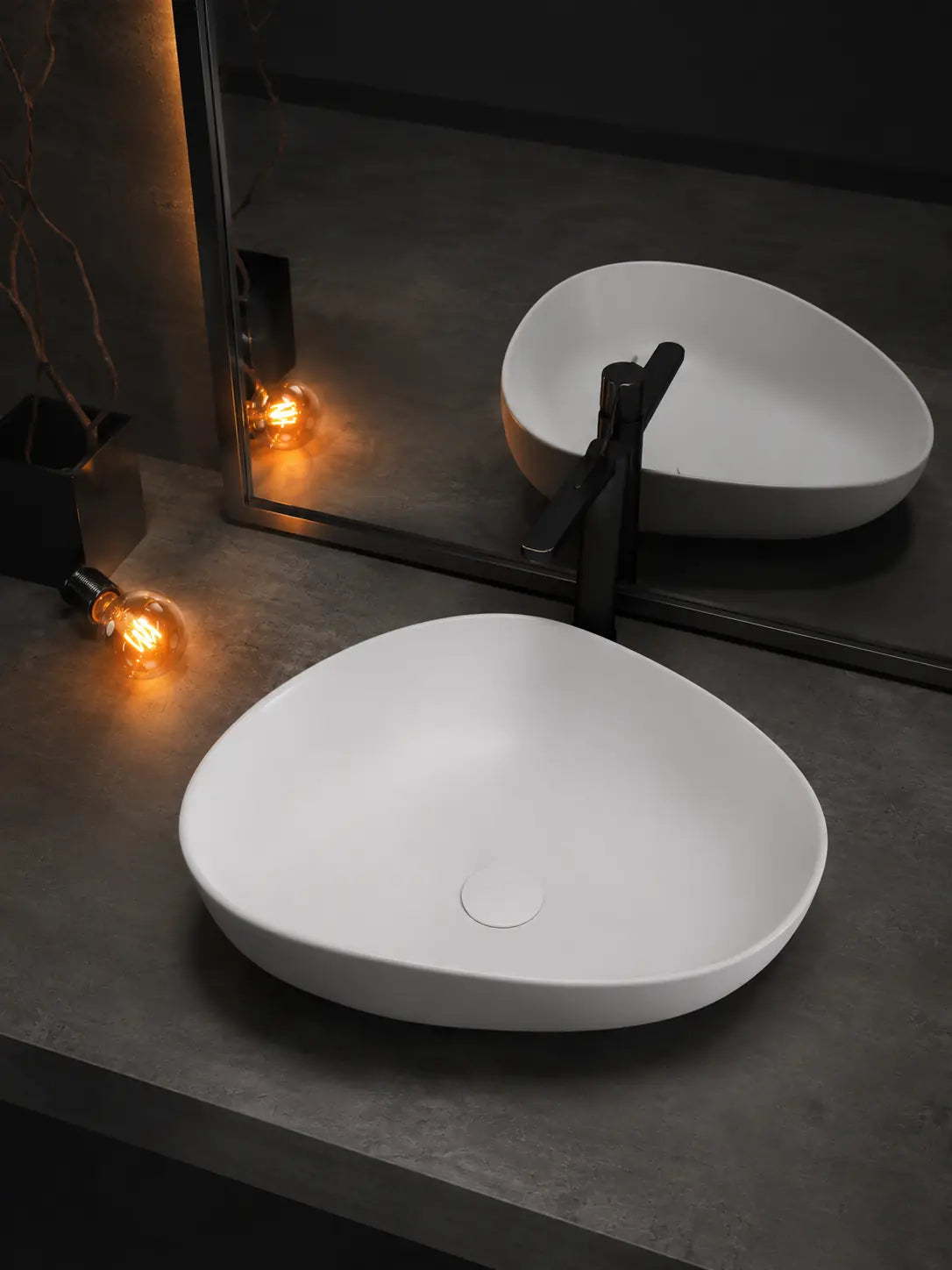 BBbidet V5MW matte white ceramic countertop basin beside a mirror and black faucet