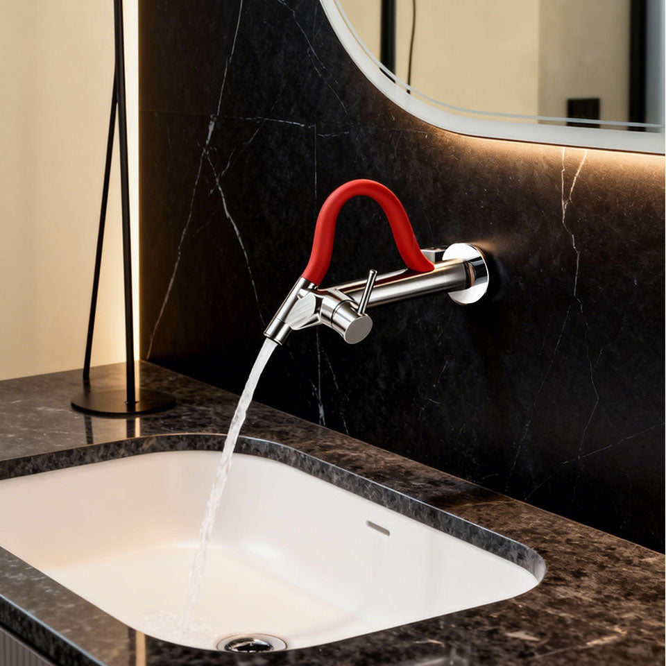 Luxury chrome wall-mounted bathroom faucet with a vibrant red flexible silicone neck, single lever handle, flowing water into an undermount white basin against a black marble tile wall.