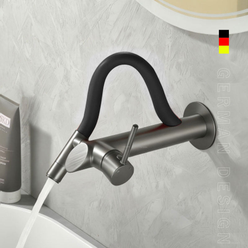German design wall-mounted bathroom faucet in brushed gunmetal grey with a sleek black flexible silicone neck, single lever handle, flowing water into a white basin