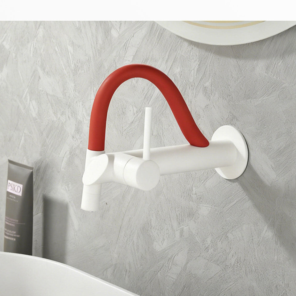 German design wall-mounted bathroom faucet in a clean matte white finish with a vibrant red flexible silicone neck and a single lever handle against a grey textured wall