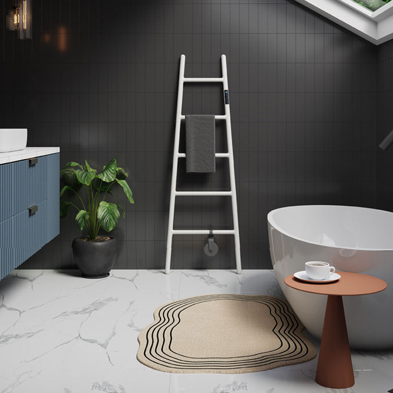 Luxury modern bathroom interior featuring a minimalist freestanding bathtub, dark tiled wall, and an elegant white ladder-style electric heated towel warmer with a smart touch display