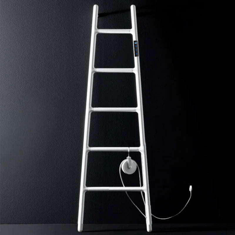 A minimalist studio product shot of a pure white ladder-style electric heated towel warmer with an integrated digital display and wire storage reel, isolated against a solid matte black background.